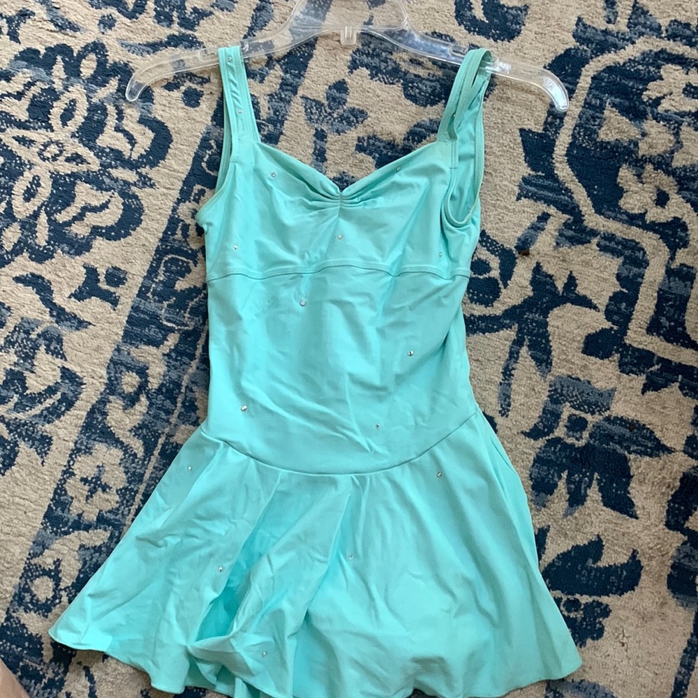 Aqua colored lyrical/Ballet costume with crystals. Includes sparkly hair piece